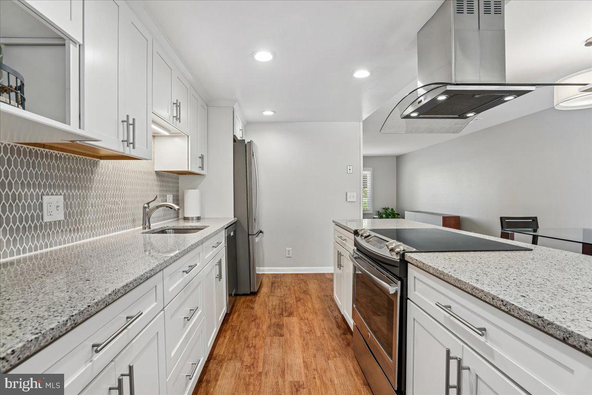14515 Fiske Drive, Unit 160A Silver Spring, MD 20906 - Photo 5 of 20 a kitchen that has a sink and a stove