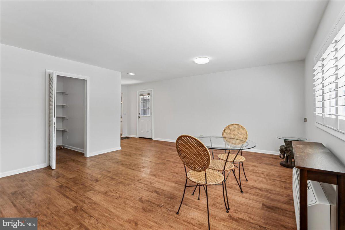 14515 Fiske Drive, Unit 160A Silver Spring, MD 20906 - Photo 8 of 20 a view of a workspace room with furniture and wooden floor