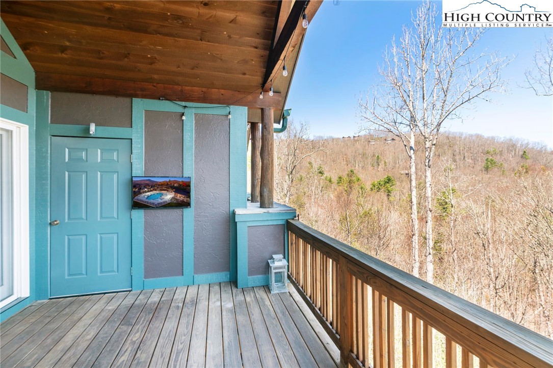 446 Peaceful Haven Drive, Unit 832 Boone, NC 28607 - Photo 13 of 38 a view of a balcony with wooden floor
