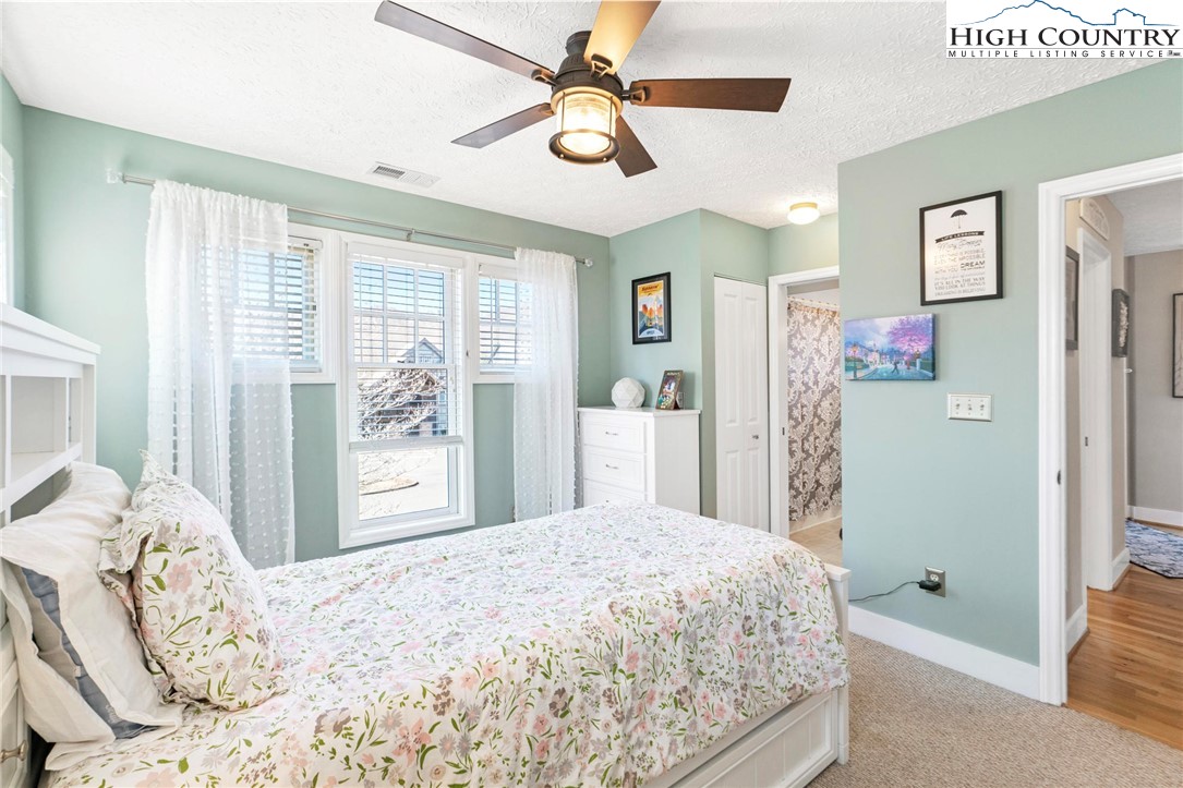 446 Peaceful Haven Drive, Unit 832 Boone, NC 28607 - Photo 23 of 38 a bedroom with a large bed and a window