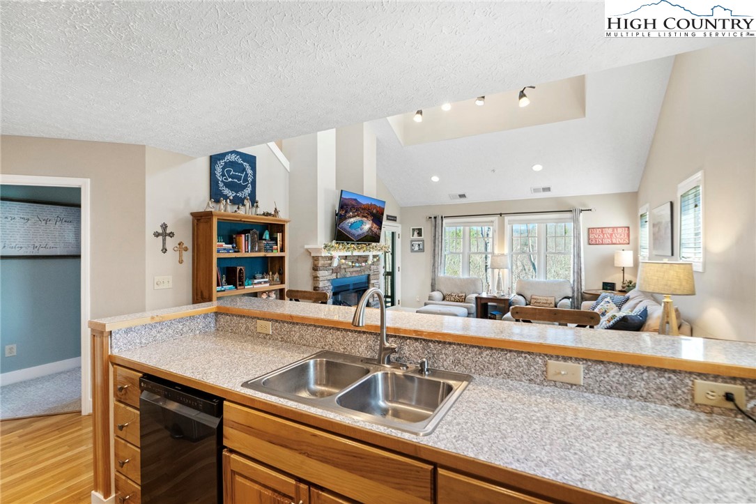 446 Peaceful Haven Drive, Unit 832 Boone, NC 28607 - Photo 10 of 38 a kitchen with a sink and a refrigerator
