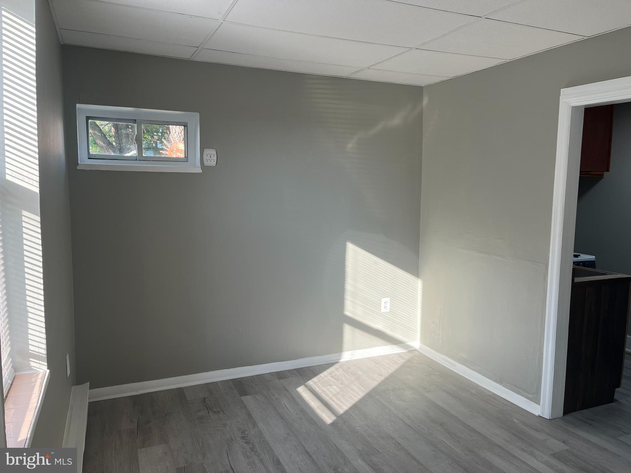 2666-00 Bridge Street Philadelphia, PA 19137 - Photo 3 of 13 an empty room with wooden floor and windows