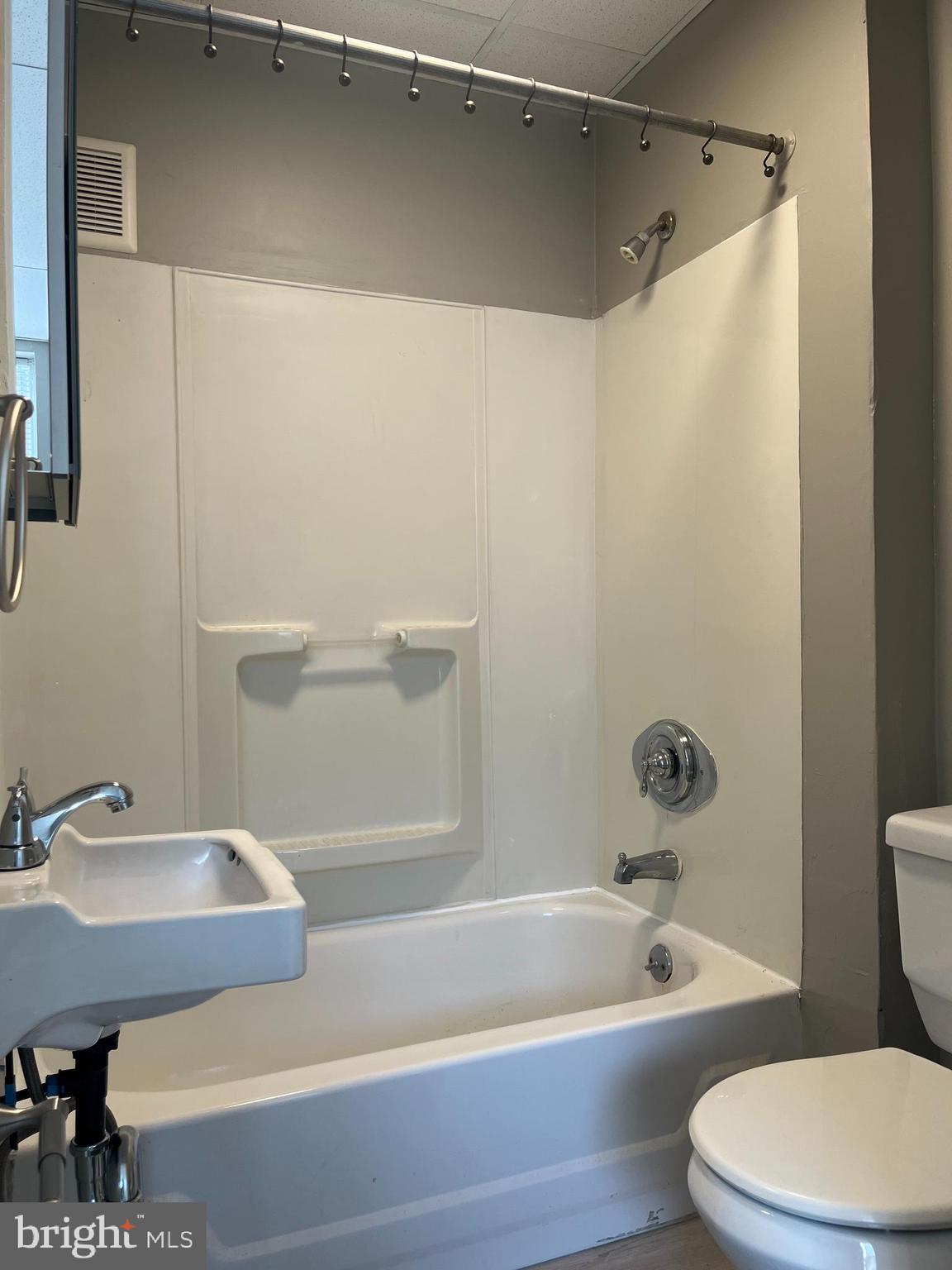 2666-00 Bridge Street Philadelphia, PA 19137 - Photo 6 of 13 a bathroom with a sink a toilet and a bathtub