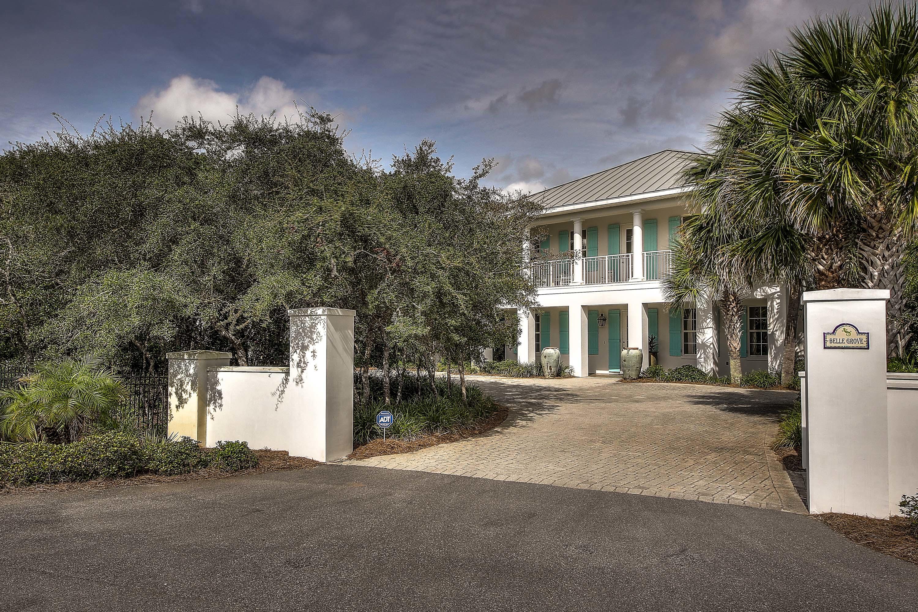 44 Brenda Lane Inlet Beach, FL 32461 - Photo 2 of 39 a front view of a house with a yard and garage