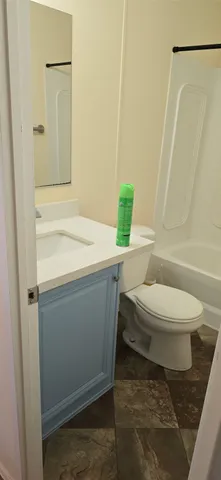a bathroom with a sink and toilet