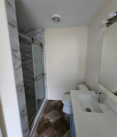 a bathroom with a sink and a shower
