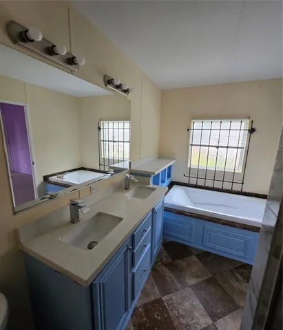 a bathroom with a sink and a bathtub