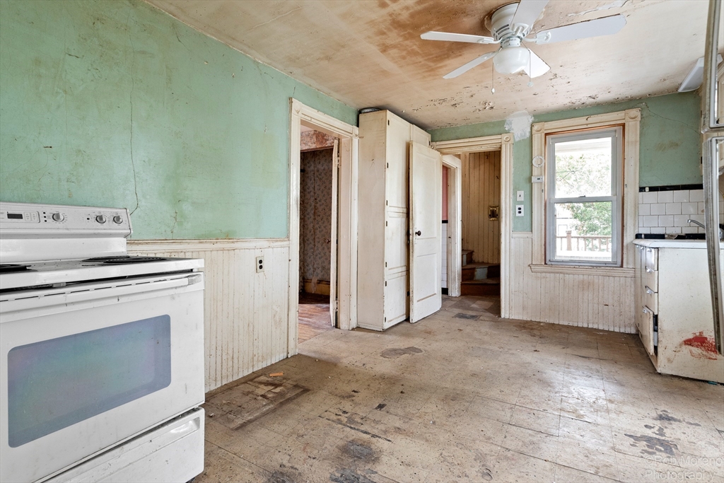 20 Harlow Street Saugus, MA 01906 - Photo 17 of 31 a view of a kitchen with a stove cabinets and a ceiling fan