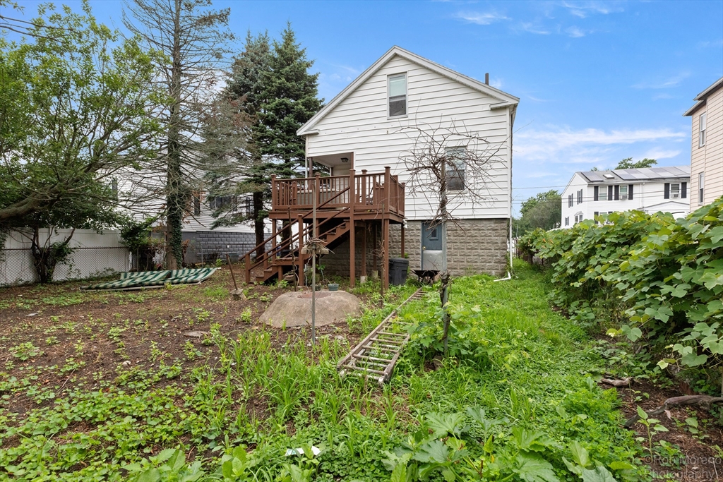 20 Harlow Street Saugus, MA 01906 - Photo 7 of 31 a view of a house with a backyard