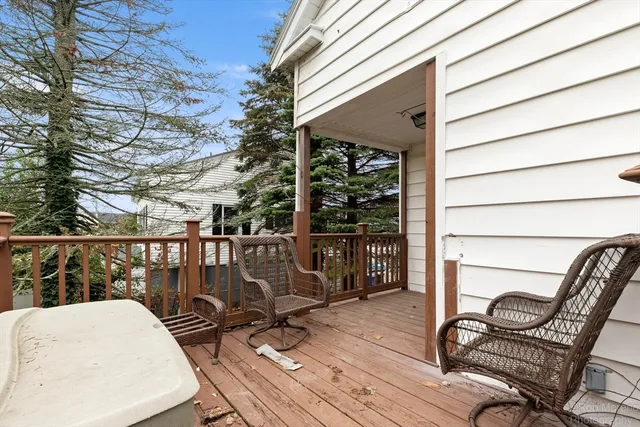 a balcony with table and chairs