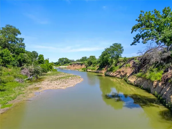 an aerial view of a house with a lake view