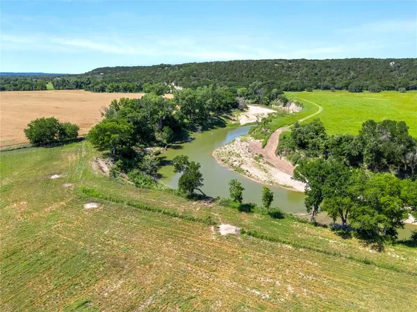 a view of a lake with a yard
