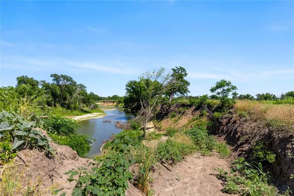 a view of a lake with a garden