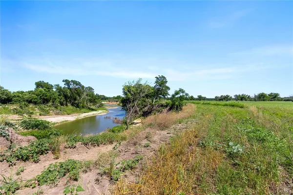 a view of lake with green space