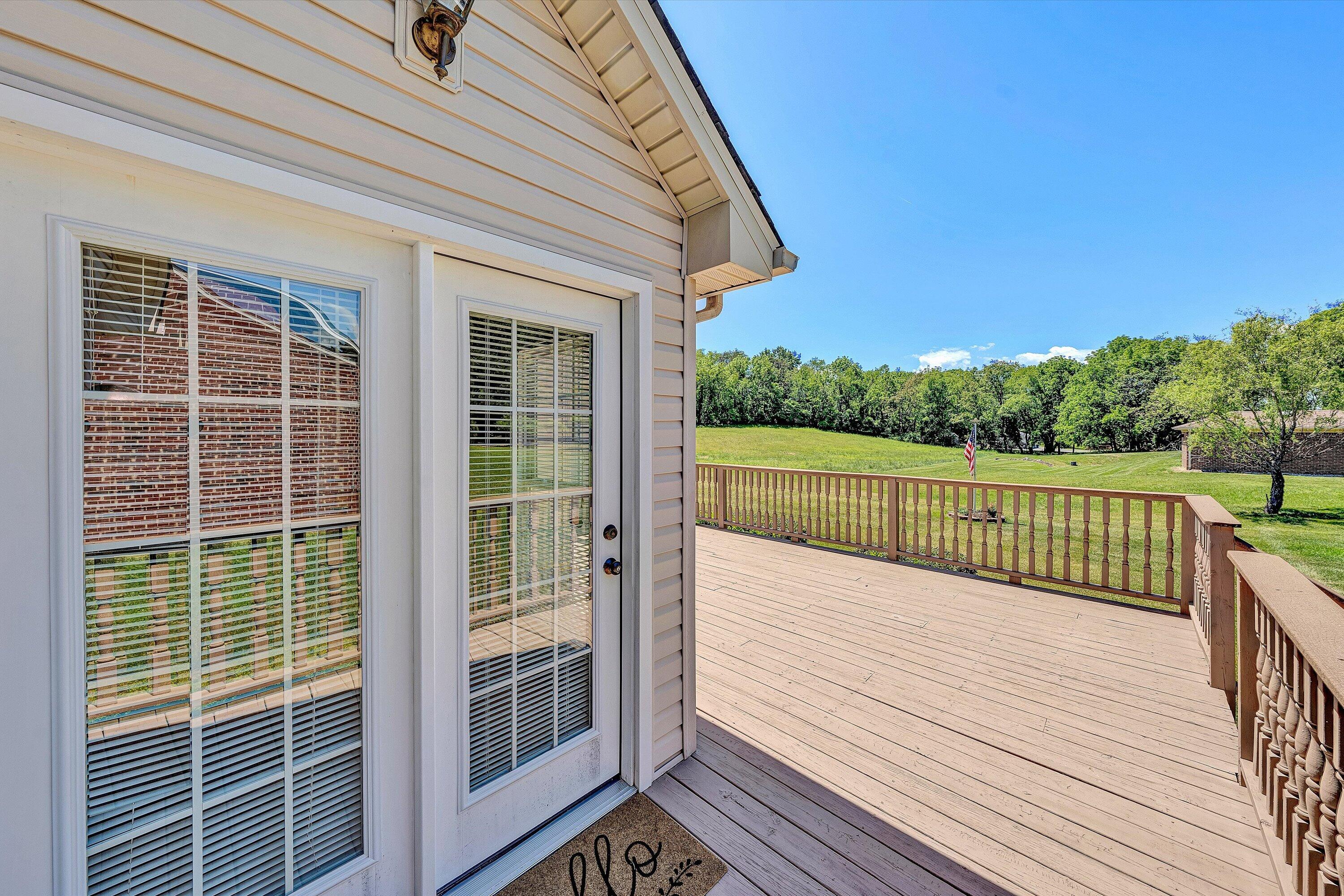 3516 Pinnacle Ridge Road Northeast Roanoke, VA 24012 - Photo 29 of 39 a view of a balcony with a floor to ceiling window and wooden fence