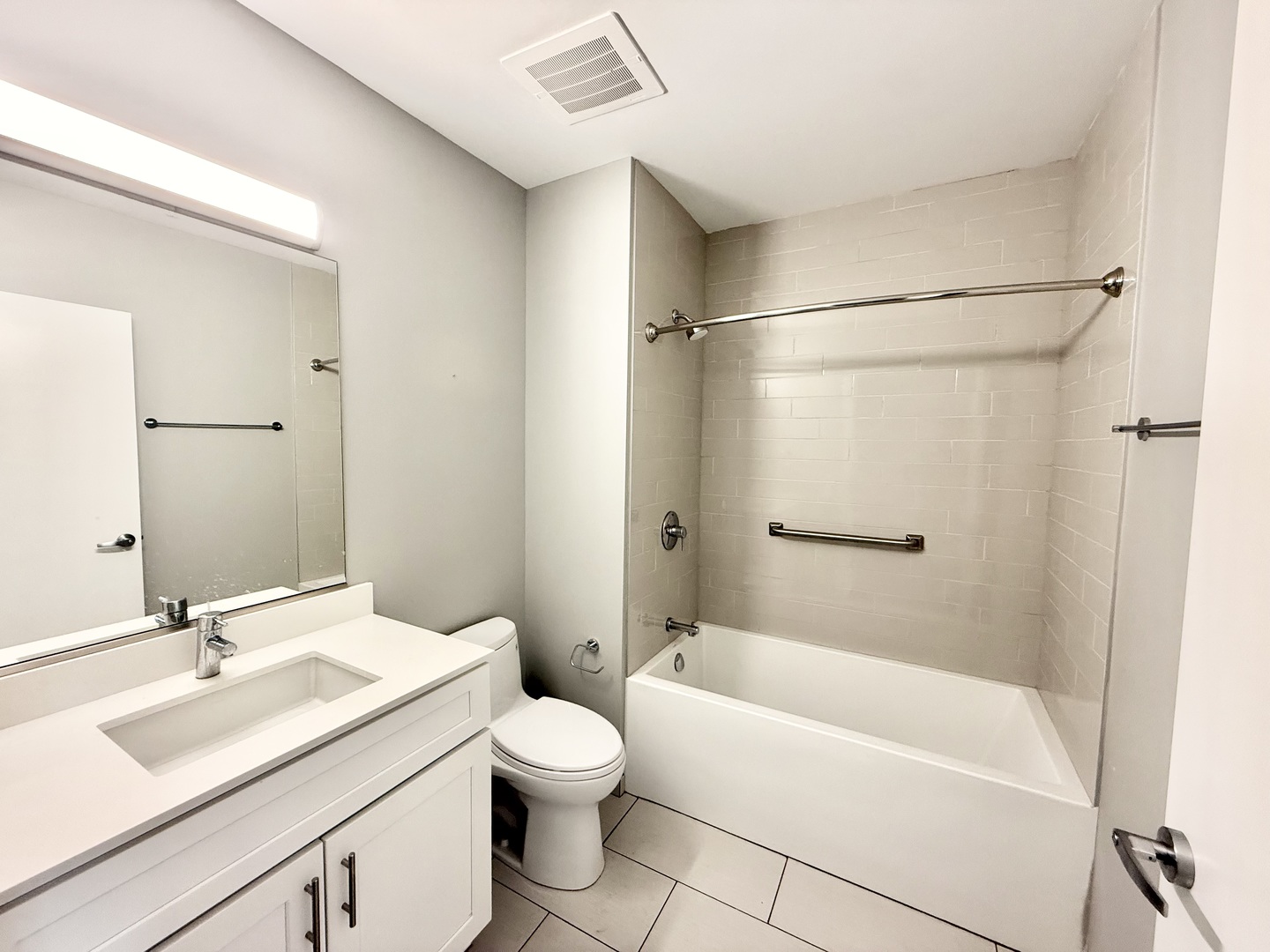 1900 West Lawrence Avenue, Unit 231 Chicago, IL 60640 - Photo 11 of 28 a bathroom with a sink toilet and shower