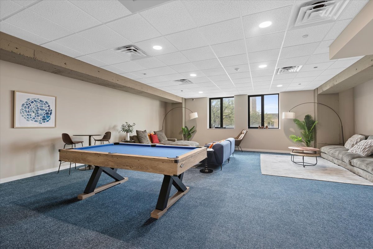 1900 West Lawrence Avenue, Unit 231 Chicago, IL 60640 - Photo 25 of 28 a living room with furniture pool table and window