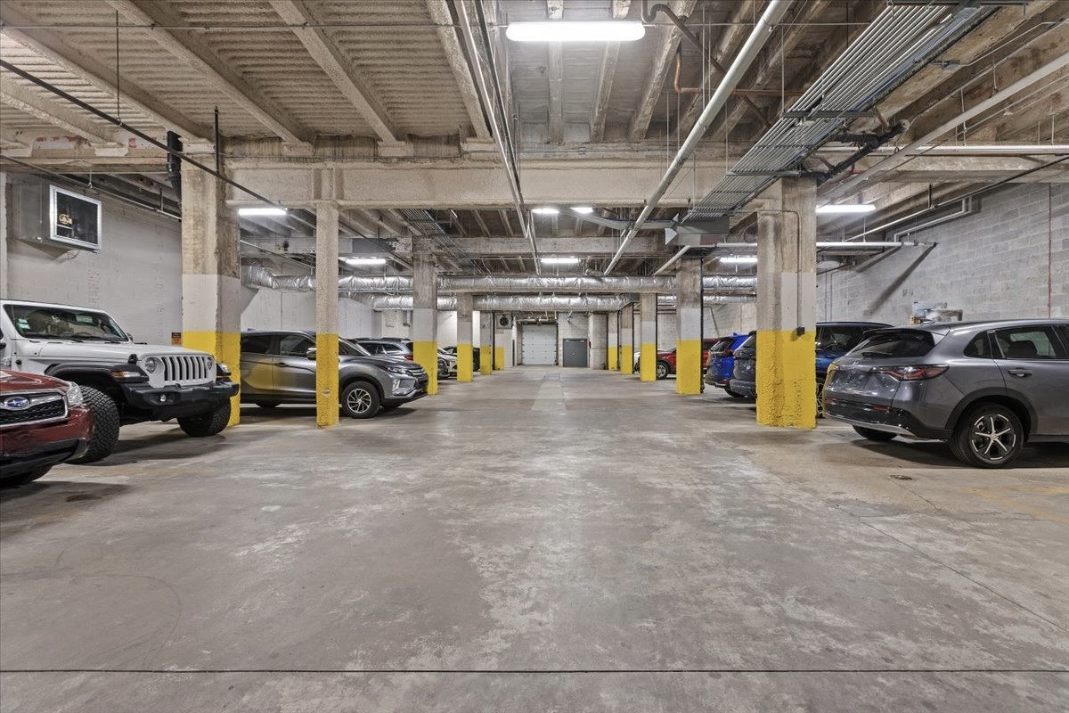1900 West Lawrence Avenue, Unit 231 Chicago, IL 60640 - Photo 28 of 28 a view of parking garage with cars parked