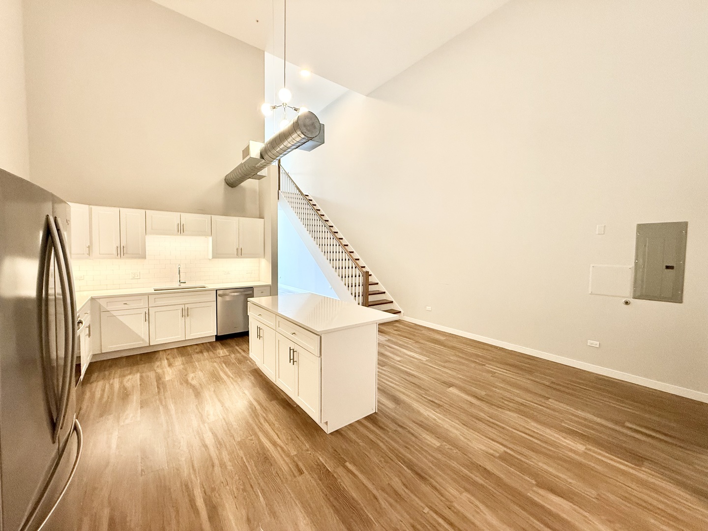 1900 West Lawrence Avenue, Unit 231 Chicago, IL 60640 - Photo 3 of 28 a view of a hallway with wooden floor