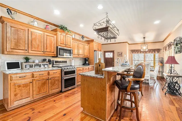 a living room with fireplace furniture and a wooden floor