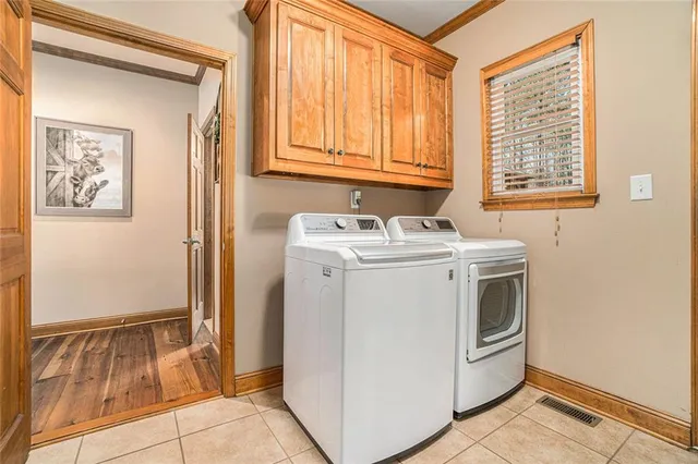 a living room with a rug and a rug