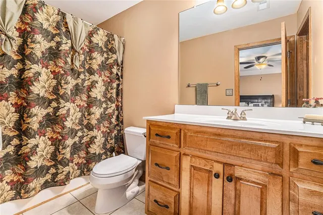 a swimming pool view with a seating space and a garden view