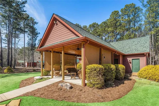 a front view of house with yard and green space