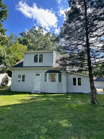 a view of front of house with a yard