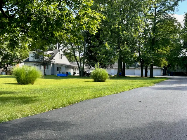 a view of a house with a big yard