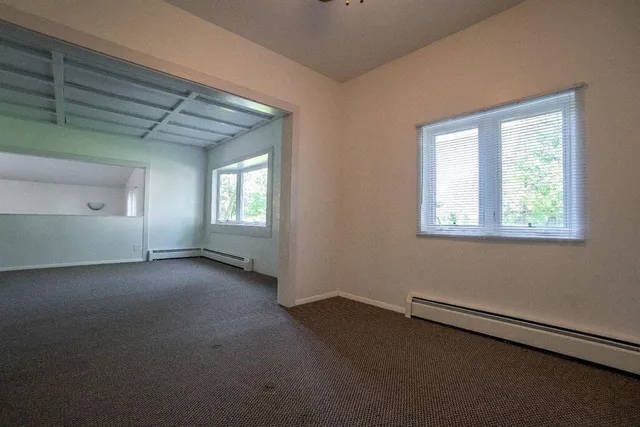 a dining room with furniture and chandelier
