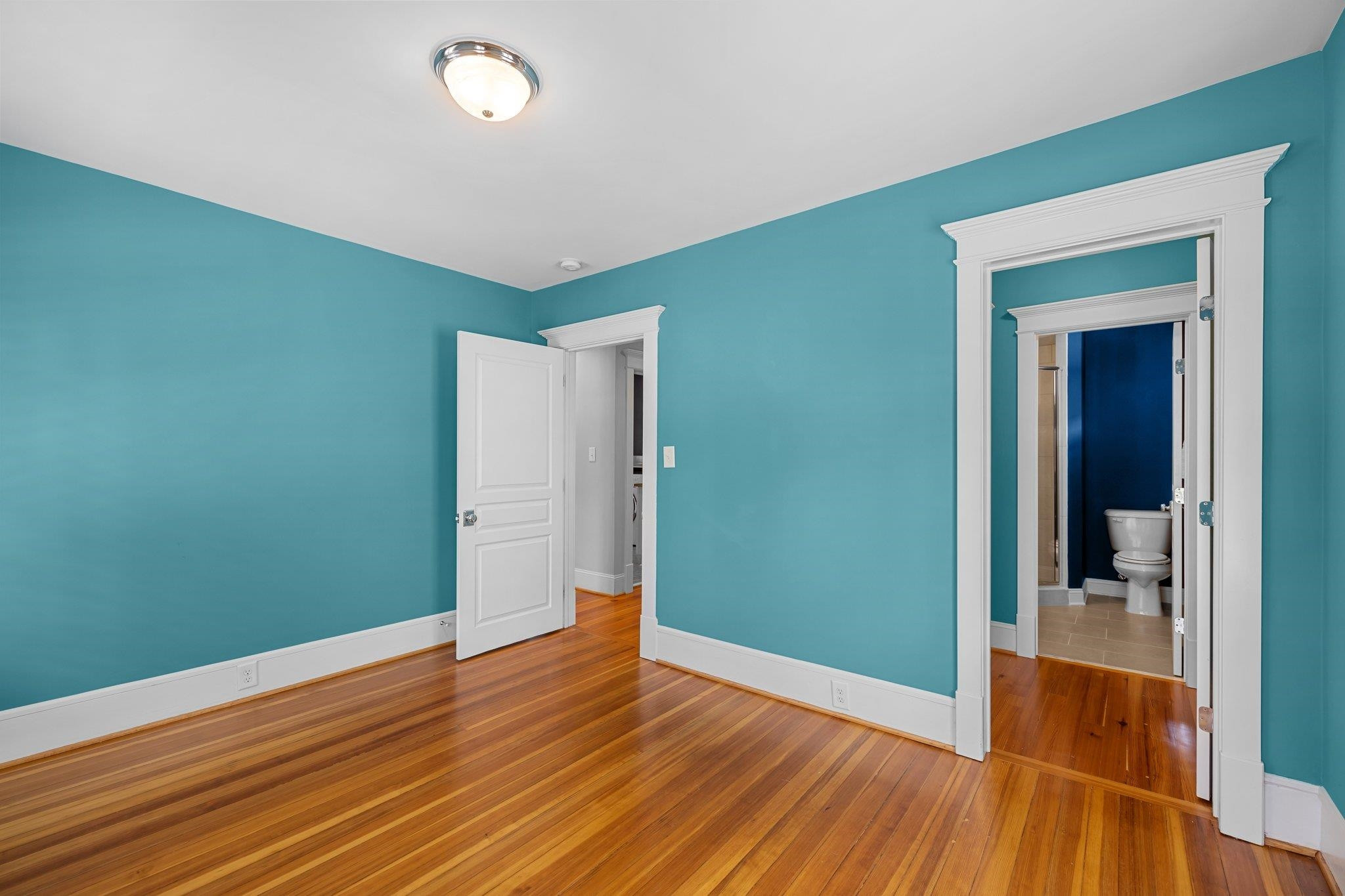 2116 Cowper Drive Raleigh, NC 27608 - Photo 48 of 65 Large bedroom with wide-plank hardwoods and great natural light. Bedroom #2