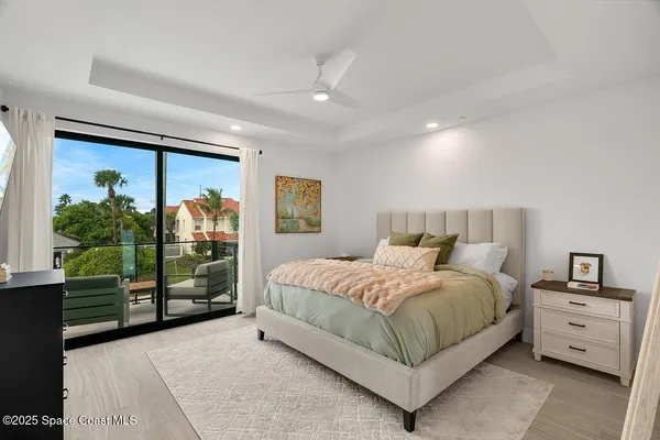 a spacious bedroom with a bed and a window