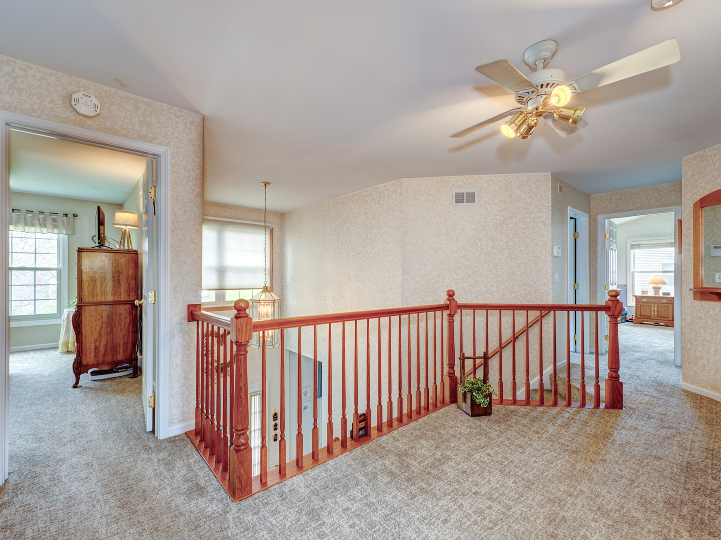5335 Fox Path Lane Hoffman Estates, IL 60192 - Photo 17 of 39 a view of a livingroom with furniture and a chandelier fan
