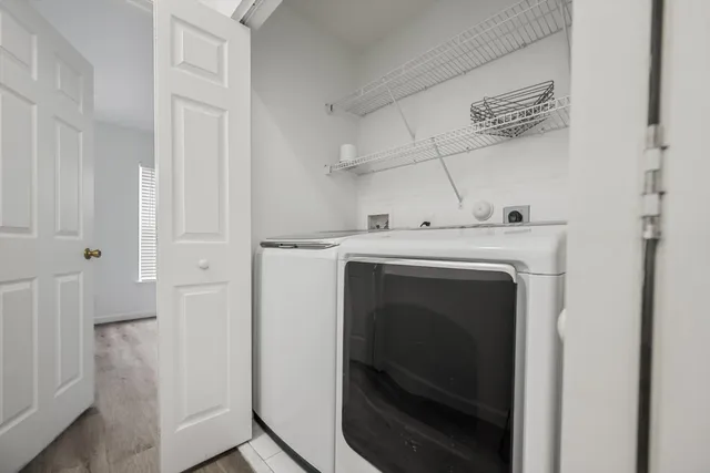 a utility room with dryer and washer