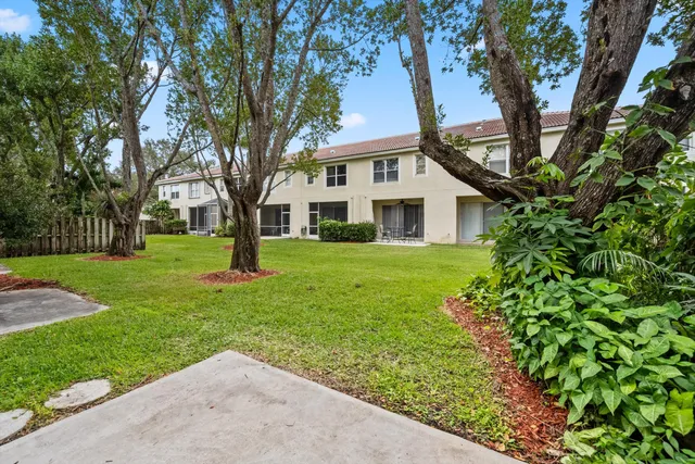 a view of a house with a tree in a park
