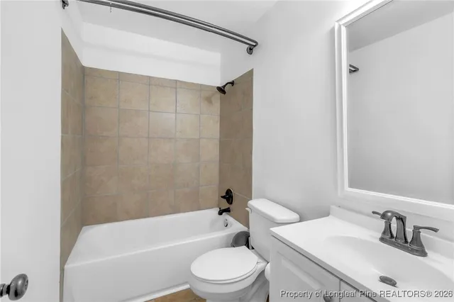 a bathroom with a sink toilet and a bathtub