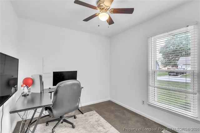 a workspace with furniture window and a chandelier