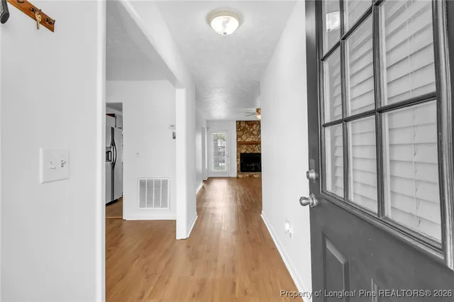 a view of gallery with wooden floor