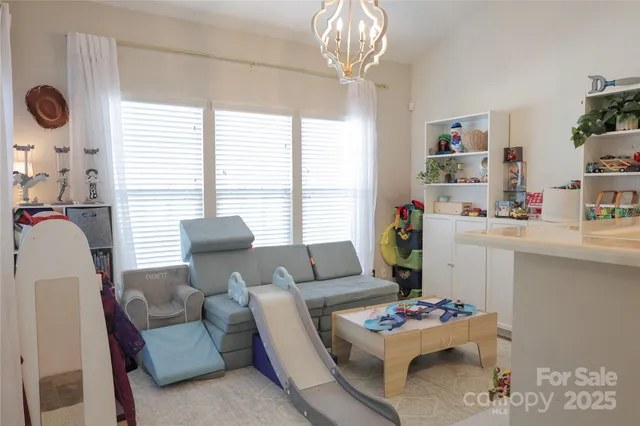 a living room with furniture and a table