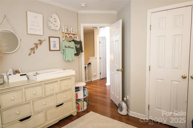 a en suite bathroom with a granite countertop sink and a mirror