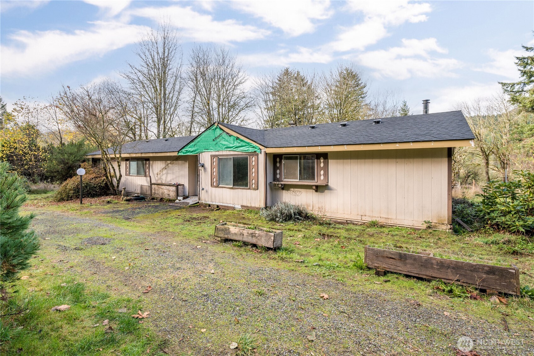 a backyard of a house with table and chairs