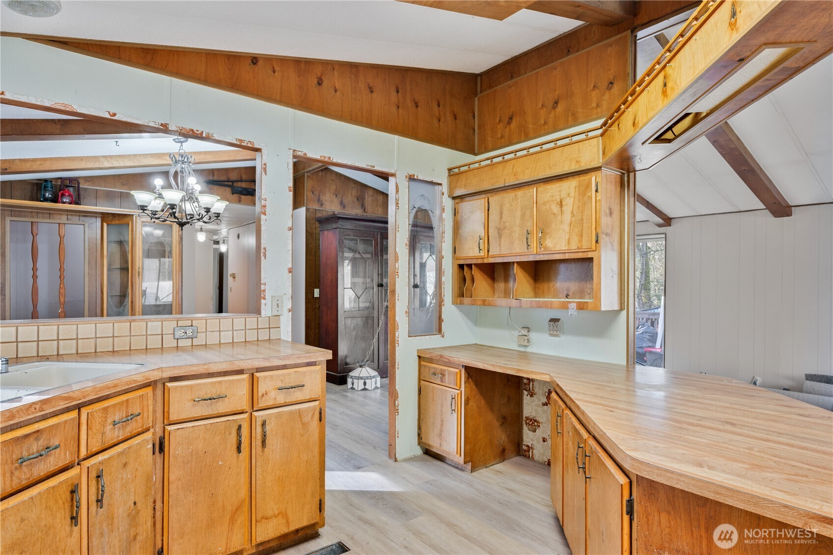 8908 Northeast Etna Road Woodland, WA 98674 - Photo 11 of 37 a kitchen with a sink and cabinets