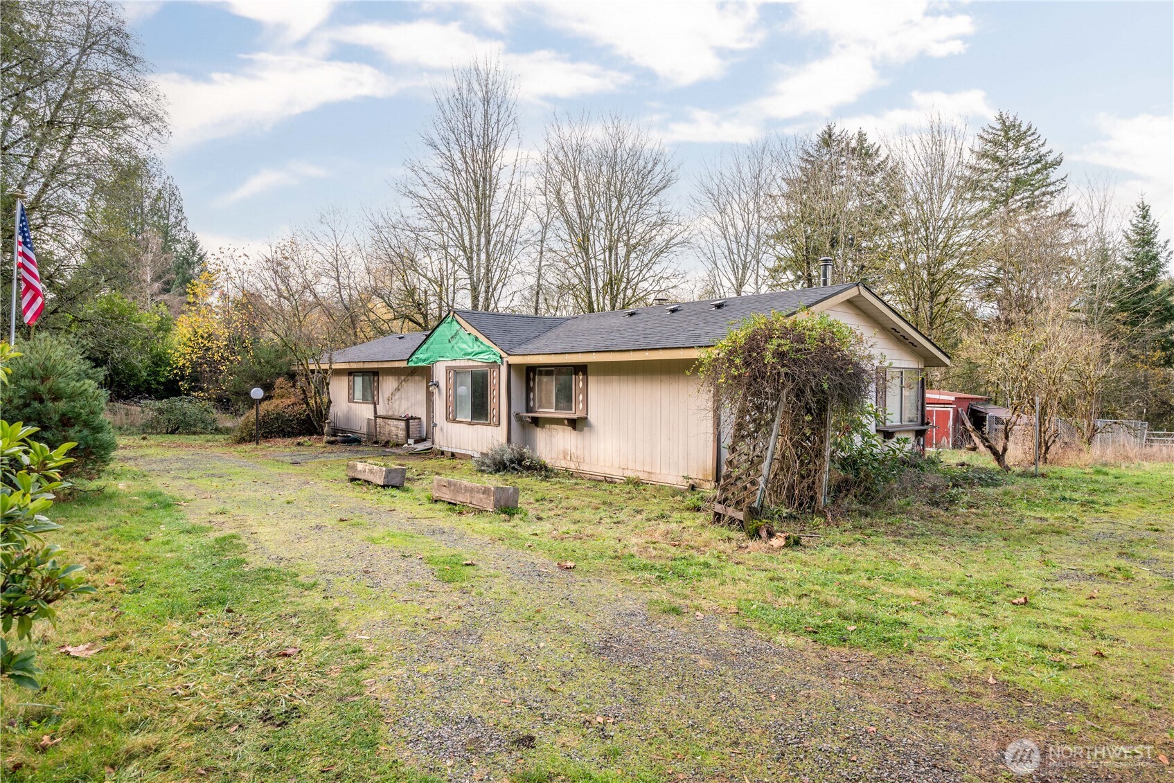 8908 Northeast Etna Road Woodland, WA 98674 - Photo 2 of 37 a view of a house with a yard