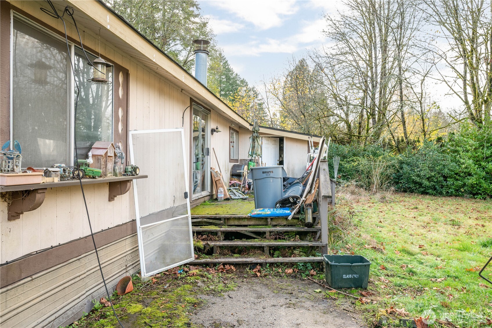8908 Northeast Etna Road Woodland, WA 98674 - Photo 24 of 37 a backyard of a house with outdoor seating