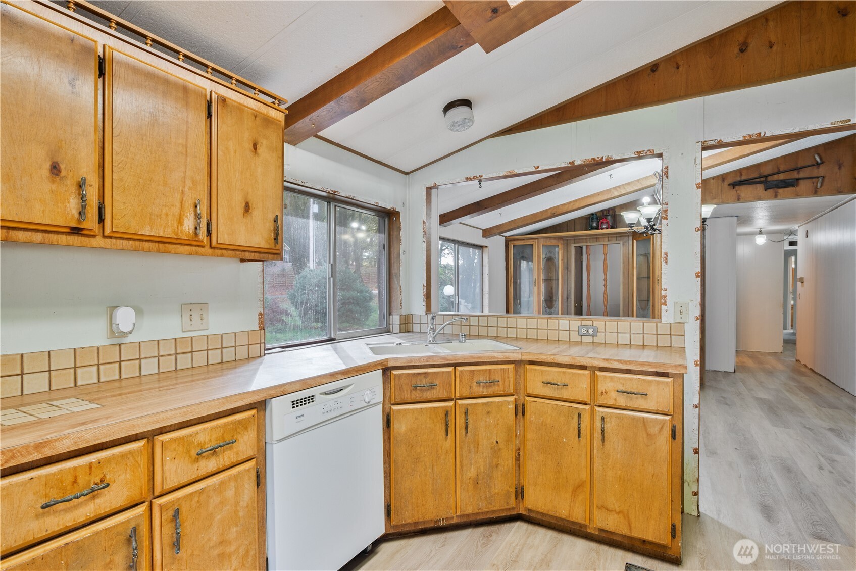 8908 Northeast Etna Road Woodland, WA 98674 - Photo 10 of 37 a kitchen with stainless steel appliances granite countertop a sink and cabinets