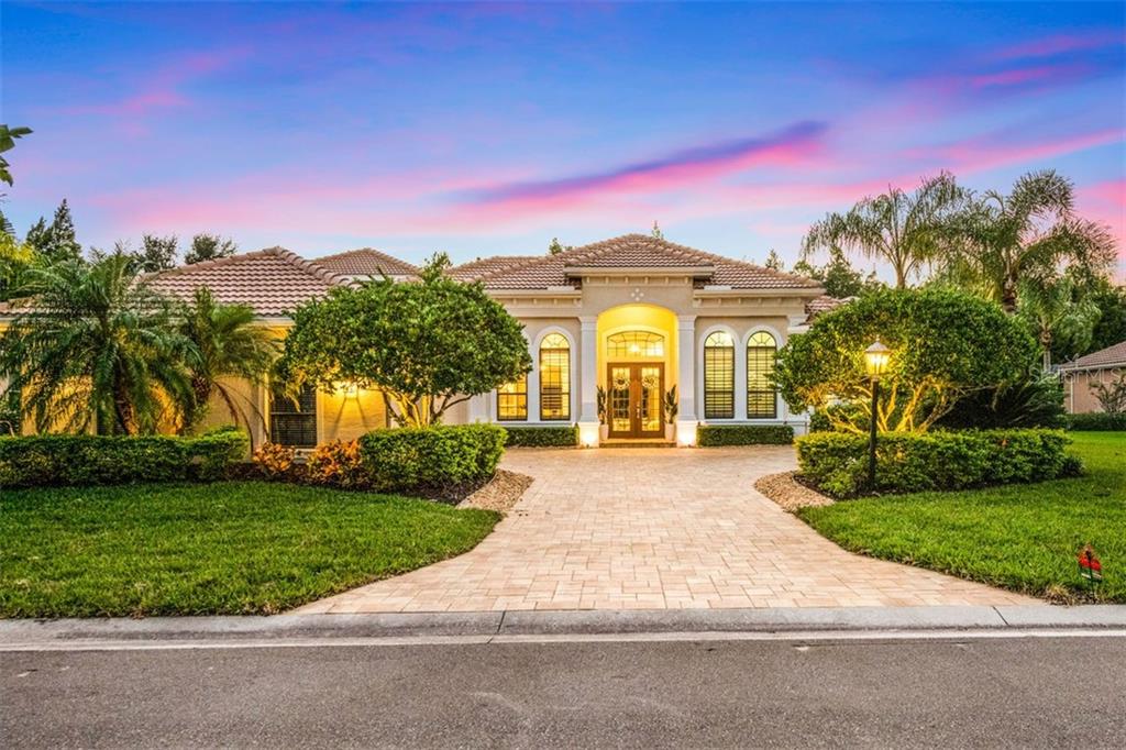 7812 Rosehall Cove Lakewood Ranch, FL 34202 - Photo 1 of 1 a front view of a house with a yard