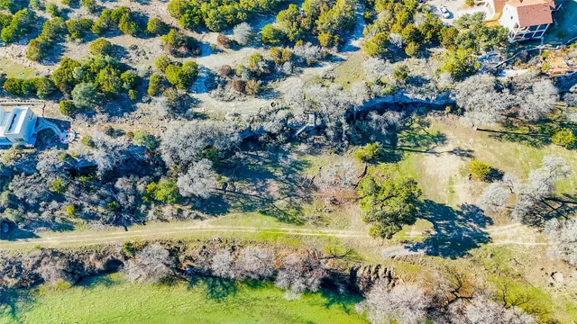 a view of grassy field with mountain