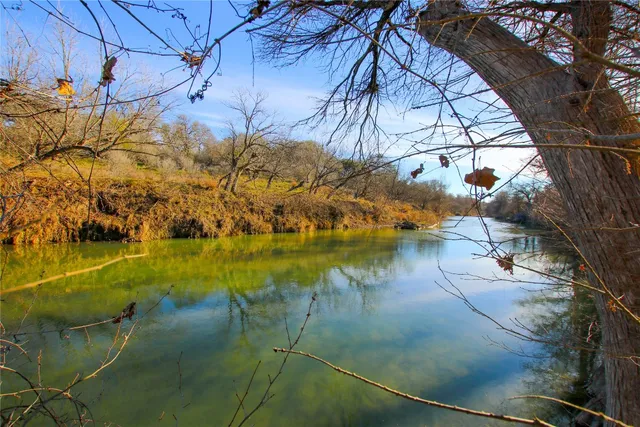 a view of a swimming pool with a yard