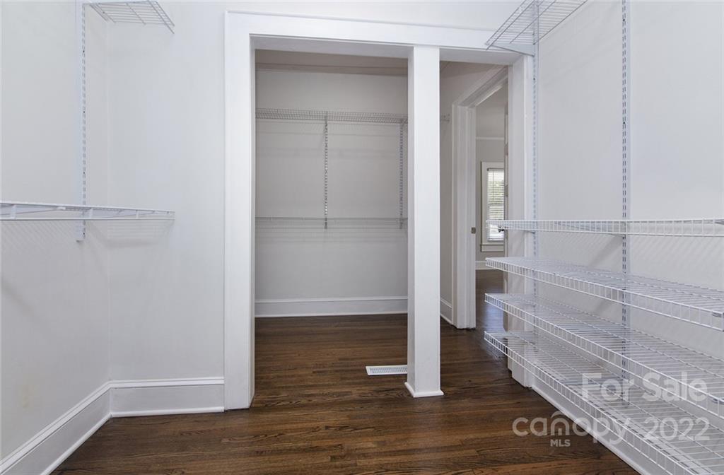 6910 Hickory Ridge Road Harrisburg, NC 28075 - Photo 15 of 21 a view of walk in closet with empty racks