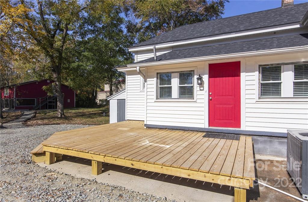 6910 Hickory Ridge Road Harrisburg, NC 28075 - Photo 5 of 21 a view of backyard with deck and outdoor seating